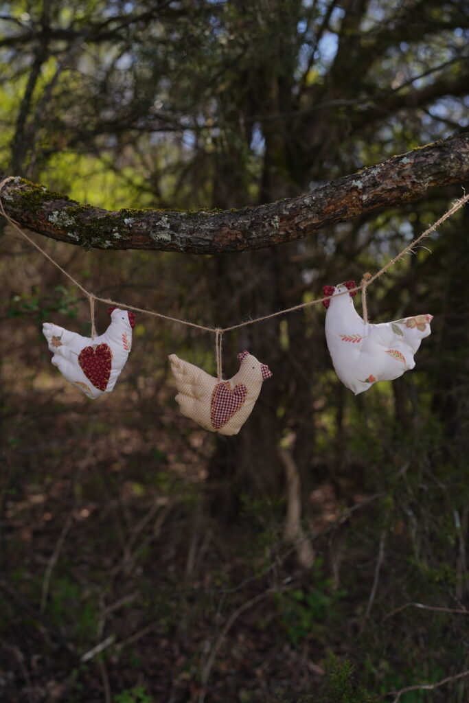 farm chicken fabric garland hanging on a twine in the woods