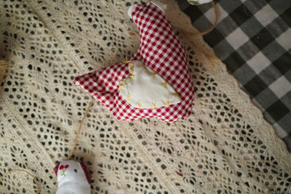 fabric chicken with tufts on its tale