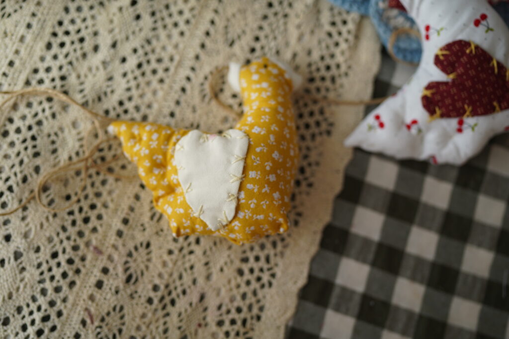 farm fabric chickens connected together with a twine 